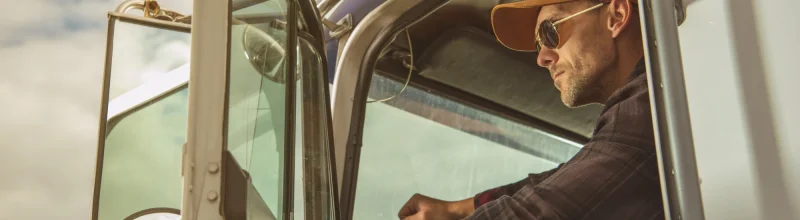 Trucker opening the door of his semi-truck